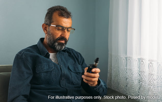 Man inspecting vape not working